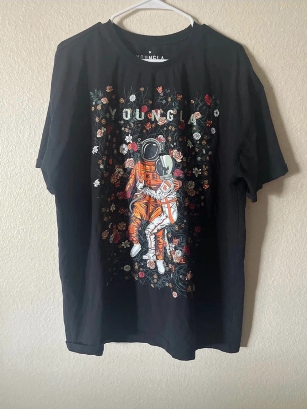YoungLA Black Tee with Orange Astronaut and Floral Graphic